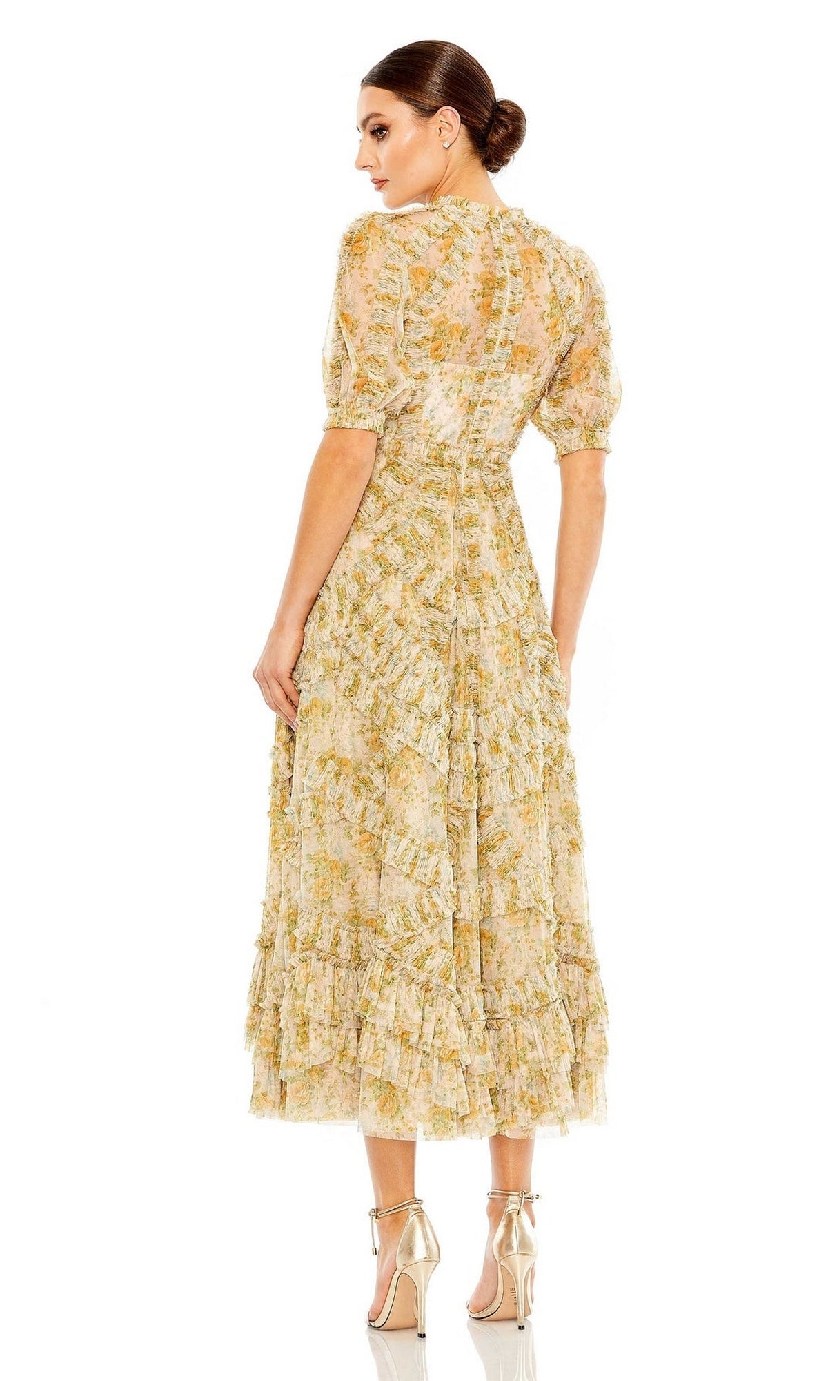 Woman wearing the Mac Duggal 80111 Short Sleeve Wedding Guest Dress with a ruffled skirt, midi floral print, and beige high-heeled sandals, standing with her back to the camera.
